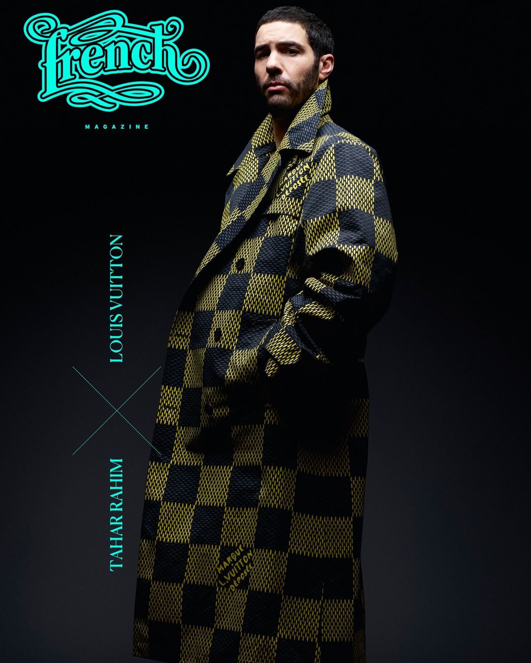 Tahar Rahim poses in a black and gold checkerboard coat, featured in French Magazine against a gradient grey background in studio lighting.