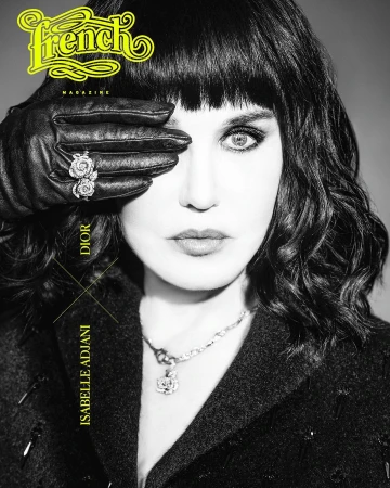 Close-up portrait of a woman with dark hair covering one eye with a black leather glove featuring a diamond ring, by Thierry Le Goues.