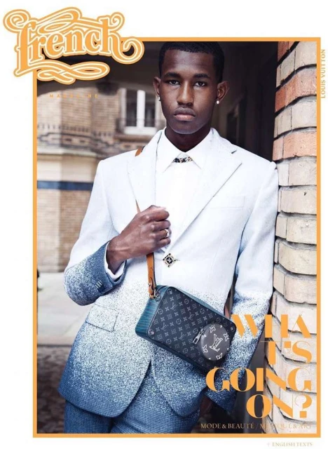 Magazine cover featuring a young man wearing a white suit with blue ombre, accessorized with a Louis Vuitton bag and jewelry.