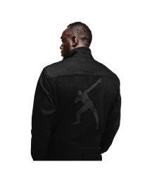 Usain Bolt wearing a black jacket with a graphic silhouette on the back against a white background