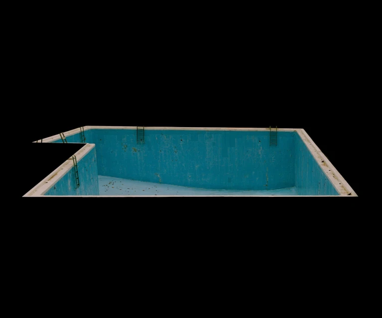 A minimalist image of an empty, rectangular swimming pool with turquoise walls, set against a stark black background, capturing an isolated scene.