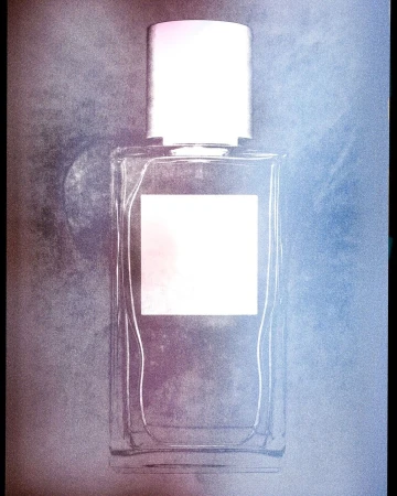 Close-up product photograph of a clear rectangular perfume bottle with a silver cap against a textured background by Thomas Deschamps
