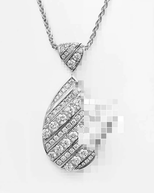 Elegant silver chain necklace with teardrop pendant encrusted with diamonds, studio shot on a white background for jewelry design.