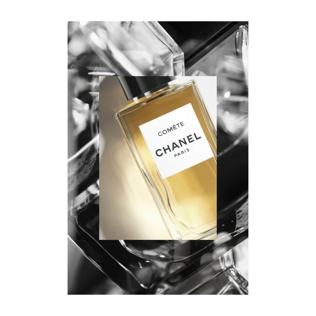 Elegant shot of Chanel Comète perfume bottle with gold liquid, displayed in a modern, minimalist composition, embodying luxury and beauty.