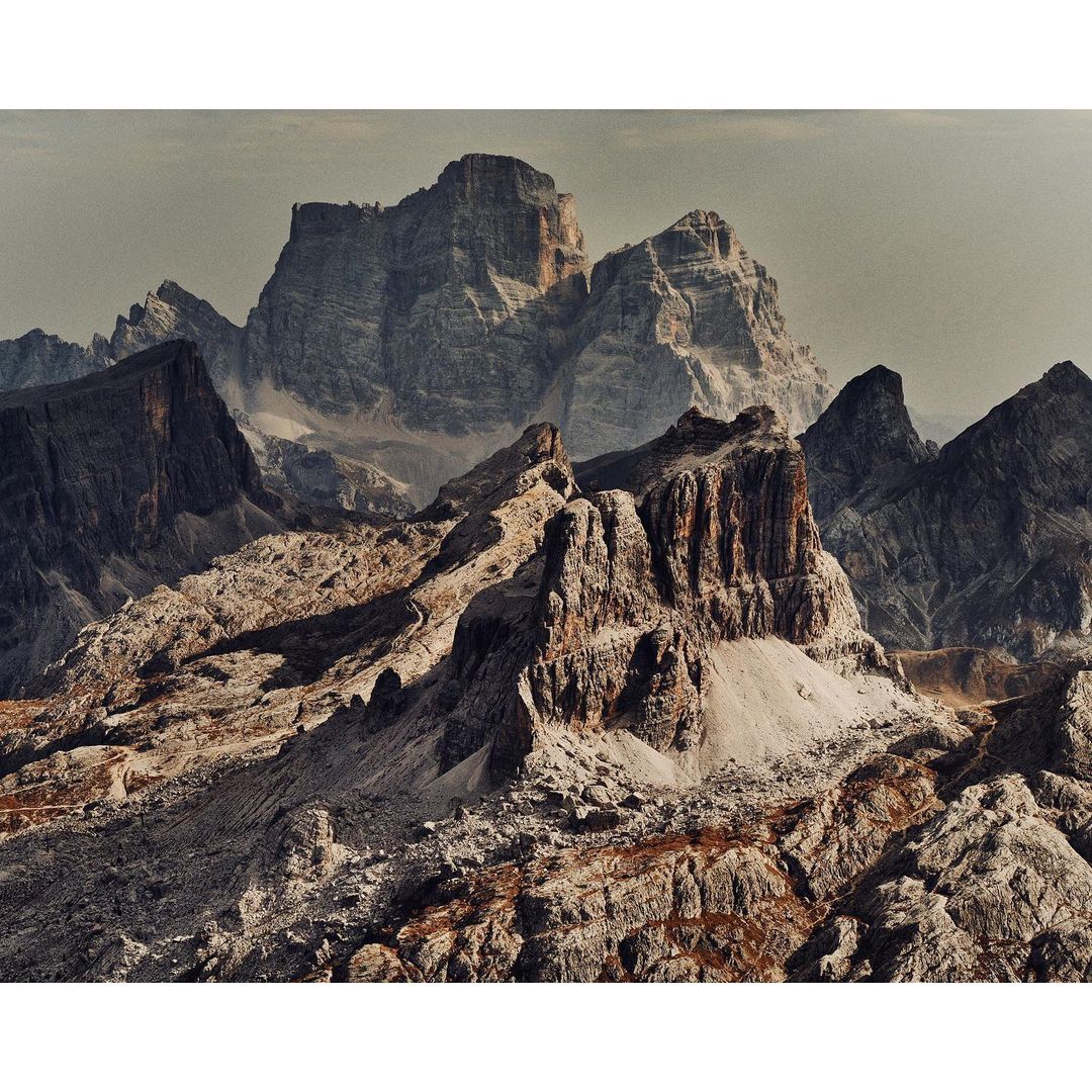 Dramatic landscape featuring rocky mountain peaks and ridges, showcasing rugged terrain and natural beauty in a scenic outdoor setting.