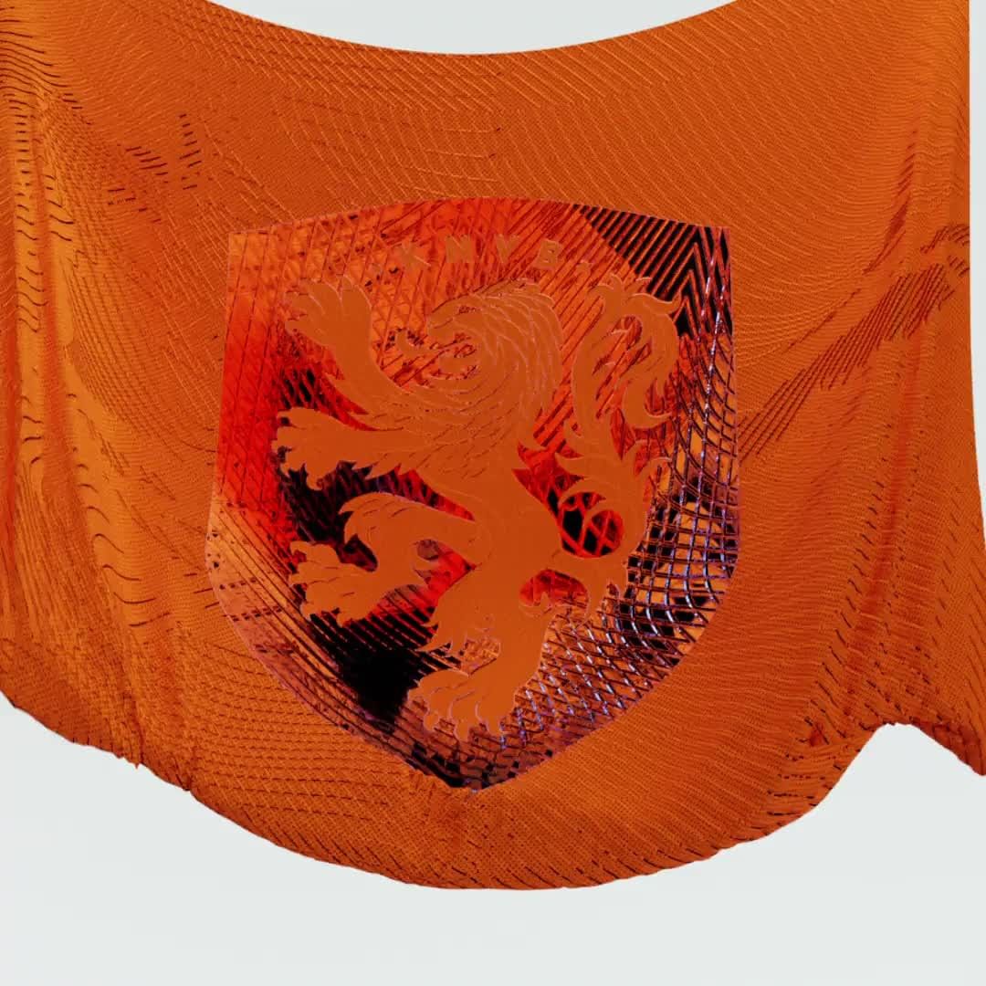Orange patterned fabric with a shield emblem featuring a lion, showcasing textures and abstract design elements against a light backdrop.