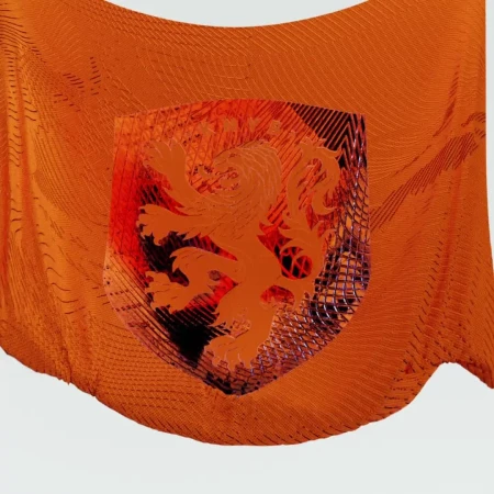 Orange patterned fabric with a shield emblem featuring a lion, showcasing textures and abstract design elements against a light backdrop.