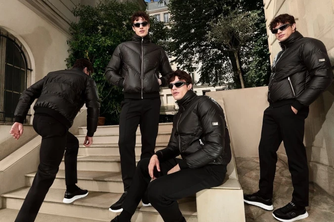 Multiple shots of a man in a black puffer jacket and sunglasses posing on stone outdoor steps.