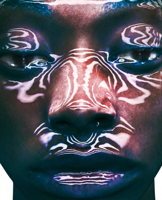 Close-up portrait of a person with white abstract patterns projected on their face in a dark, moody setting with blue and red hues.