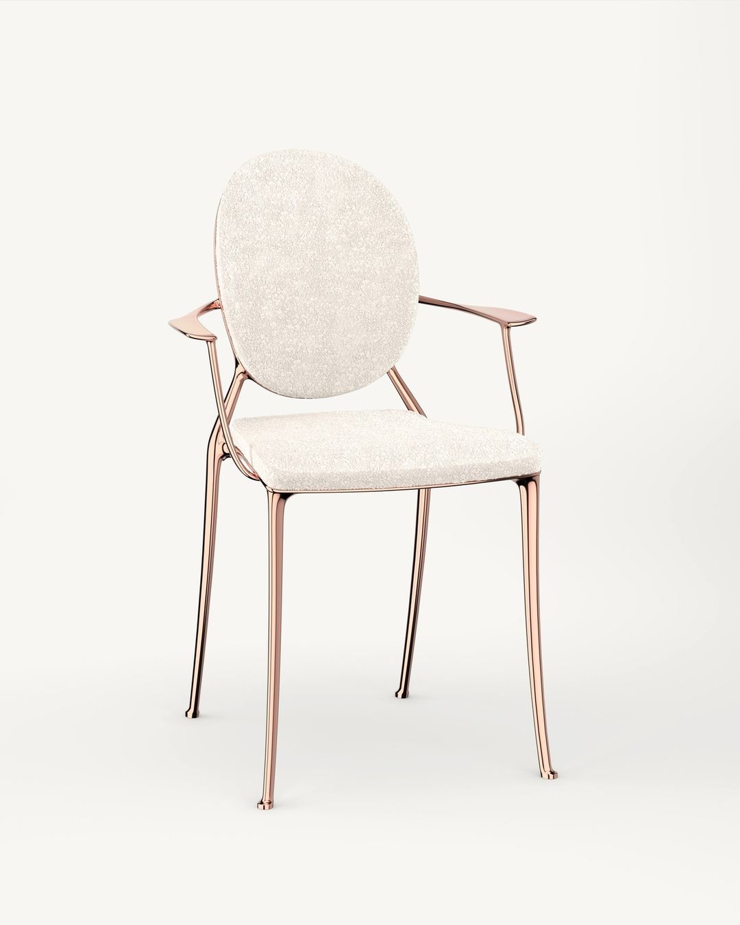 Upholstered armchair with rose gold metal frame, round backrest, and textured off-white fabric. Contemporary interior design.
