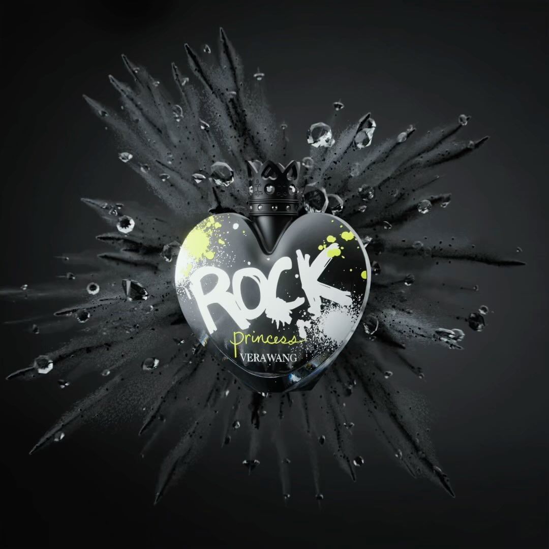Heart-shaped perfume bottle with a crown cap, featuring 'Rock Princess' text, surrounded by water droplets and black smoky accents against a dark backdrop.