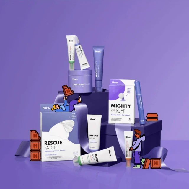 Hero Cosmetics skincare product assortment in a purple color scheme with stylized cartoon people and product packaging. Studio product shot.