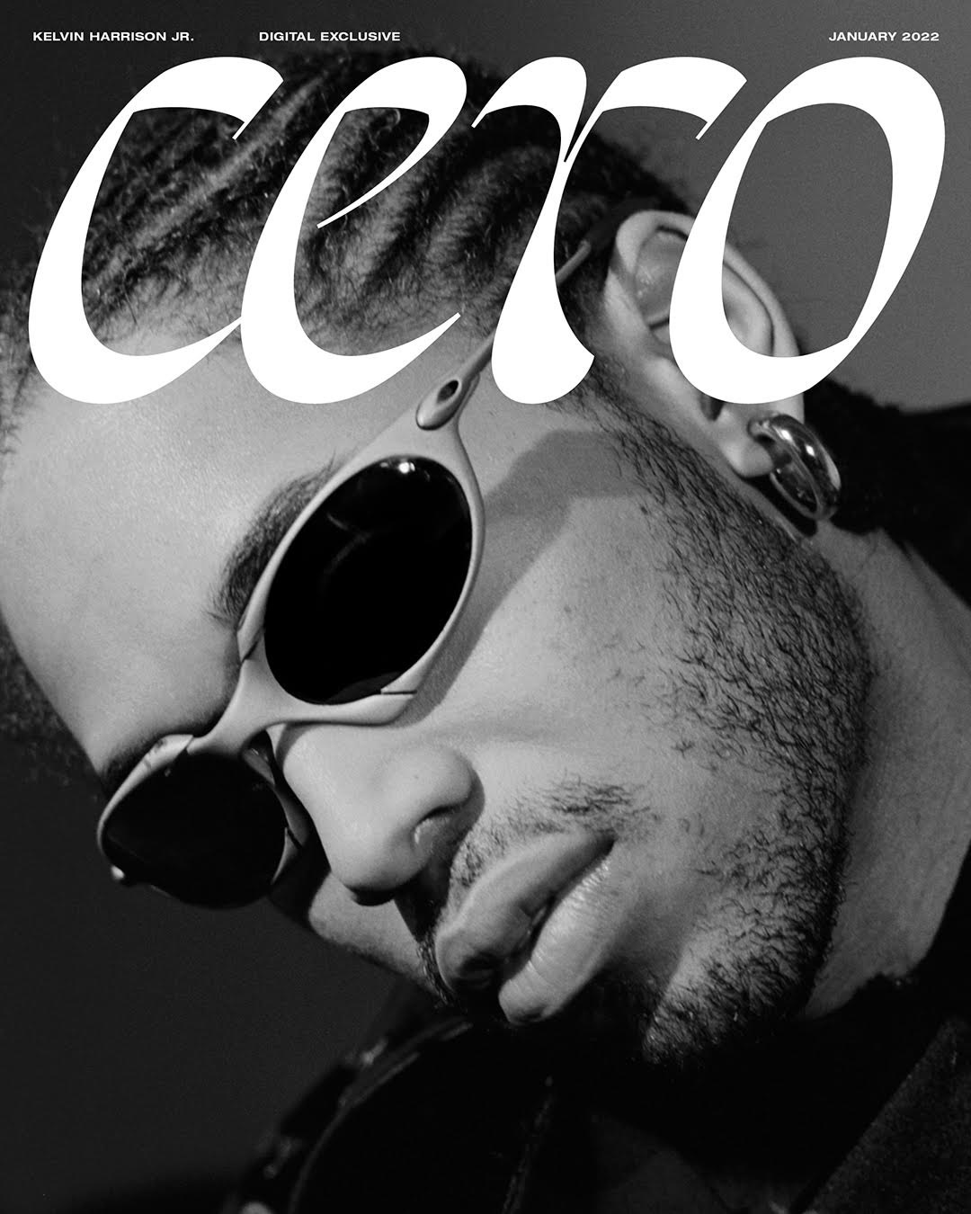 Black and white magazine cover featuring Kelvin Harrison Jr. wearing sunglasses and large text overlay, in close-up, January 2022.