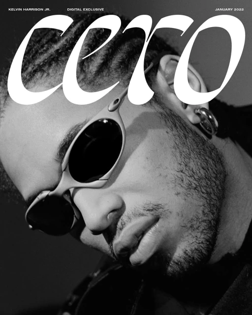 Black and white magazine cover featuring Kelvin Harrison Jr. wearing sunglasses and large text overlay, in close-up, January 2022.