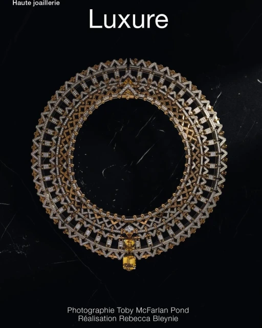 Opulent gold and diamond necklace against a dark marble background, showcased with elegant photography and luxury brand styling.