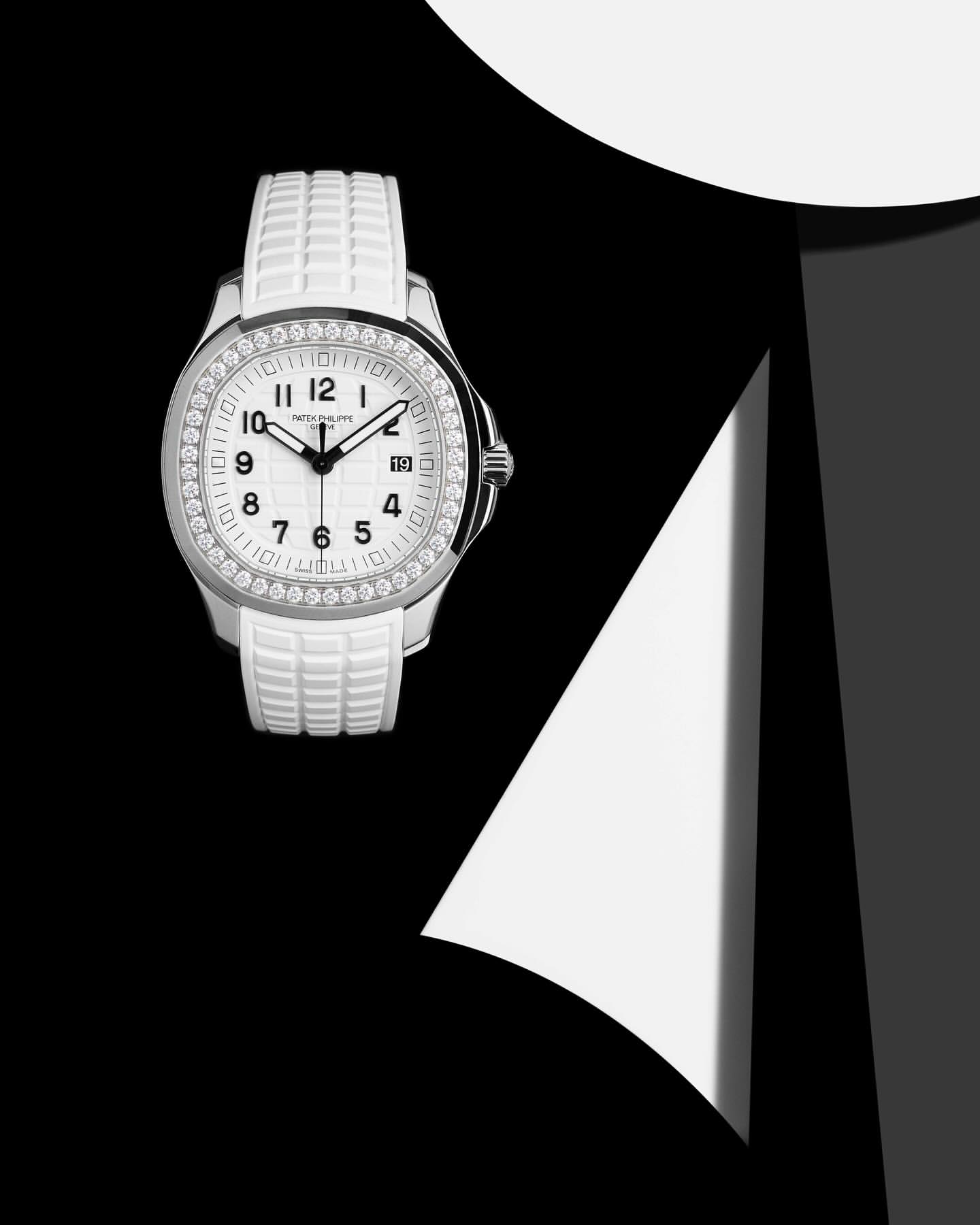 Wristwatch close-up featuring a silver and white color palette, showcasing a round face with diamond embellishments.