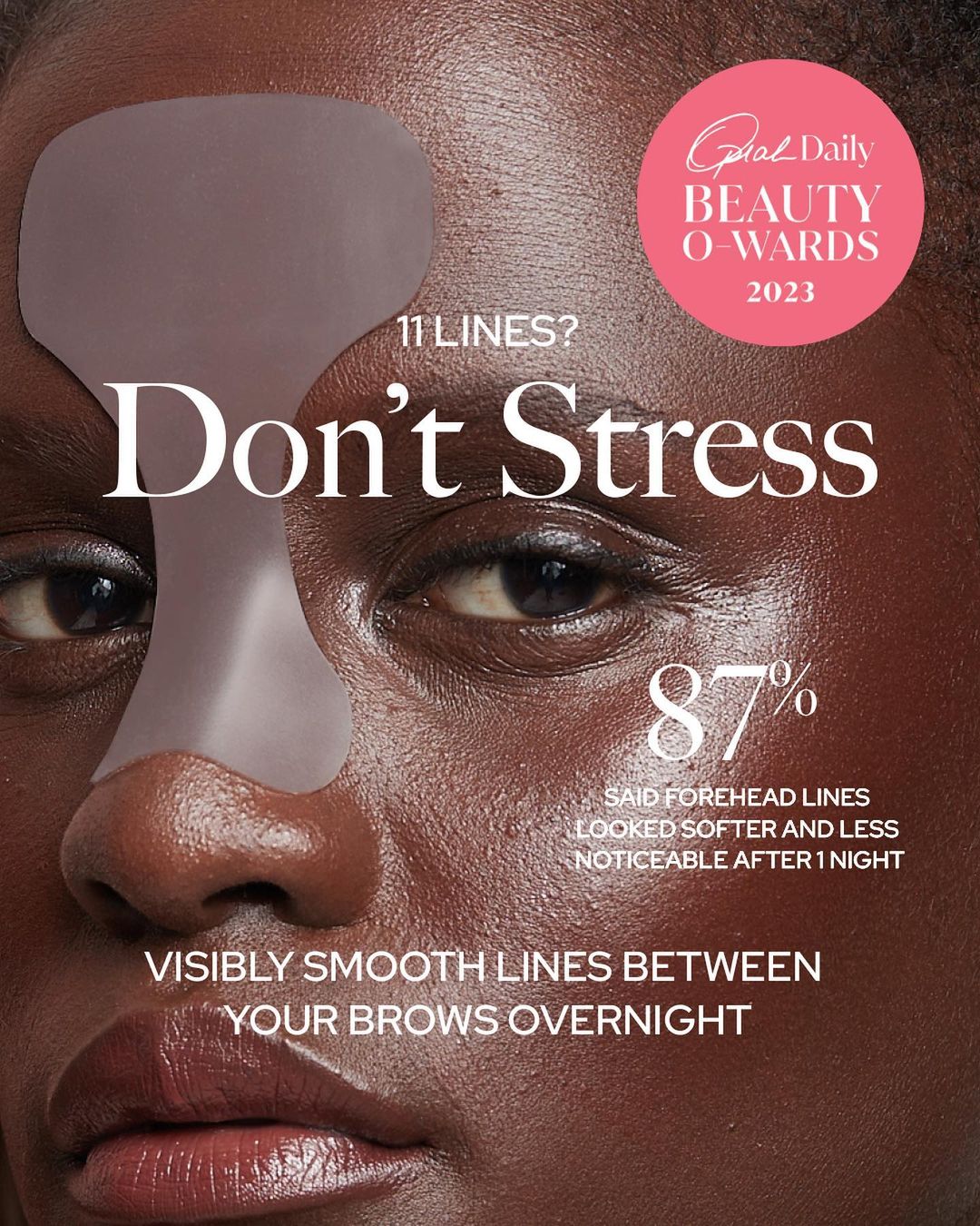 Close-up of a woman's face wearing a transparent adhesive patch on her forehead, advertising skincare for smoother lines.