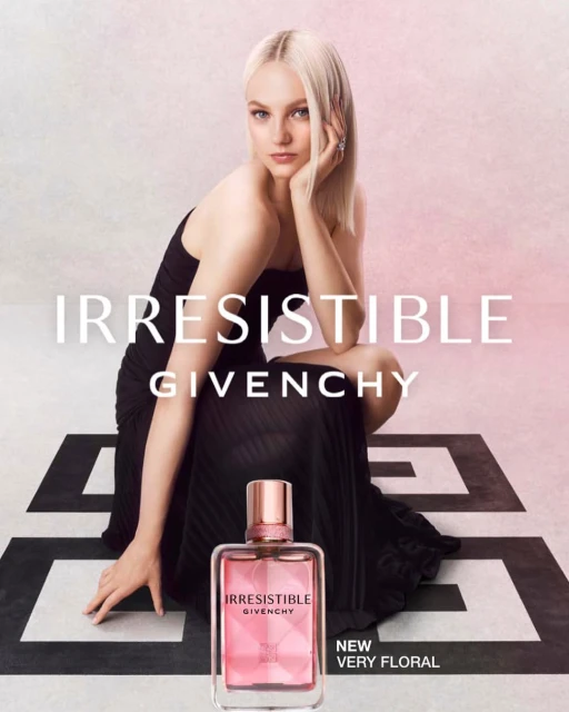 A striking beauty advertisement featuring a model with platinum blonde hair and a bottle of Givenchy Irresistible perfume.