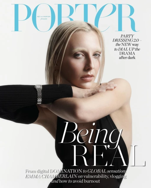 Emma Chamberlain cover portrait for Porter Magazine. She wears a black dress, and a silver wristwatch. The background is white.