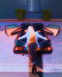 Woman leaning against the rear of a dark sports car with open gull-wing doors against a paved wall background.