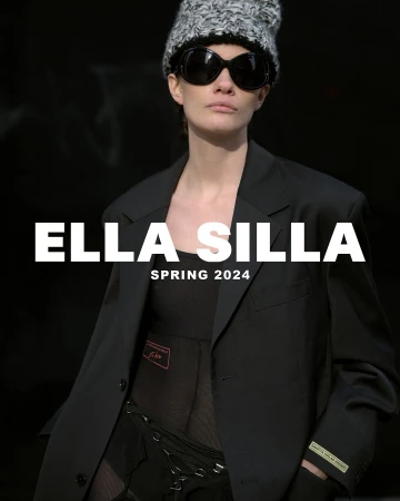Fashion shot of a woman wearing a black blazer, knit hat, and sunglasses against a dark background with the text 'Ella Silla Spring 2024'.