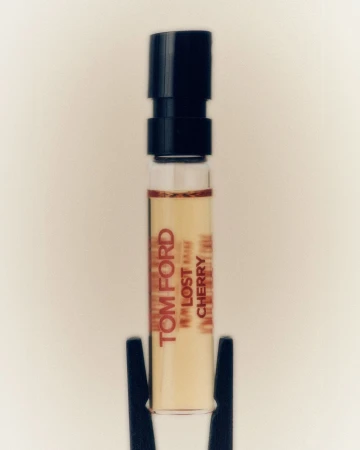 Tom Ford Lost Cherry perfume sample vial with black cap on white background for beauty and fragrance product shot.