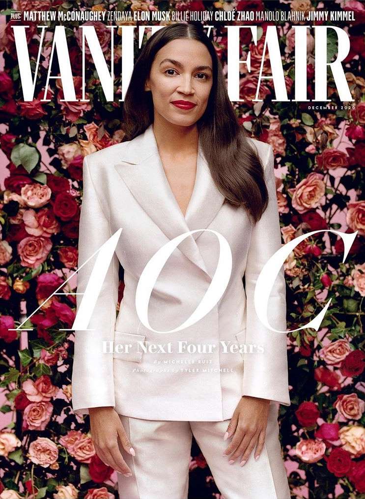 Vanity Fair cover featuring an adult female in a white suit against a floral background, with magazine text and title visible.