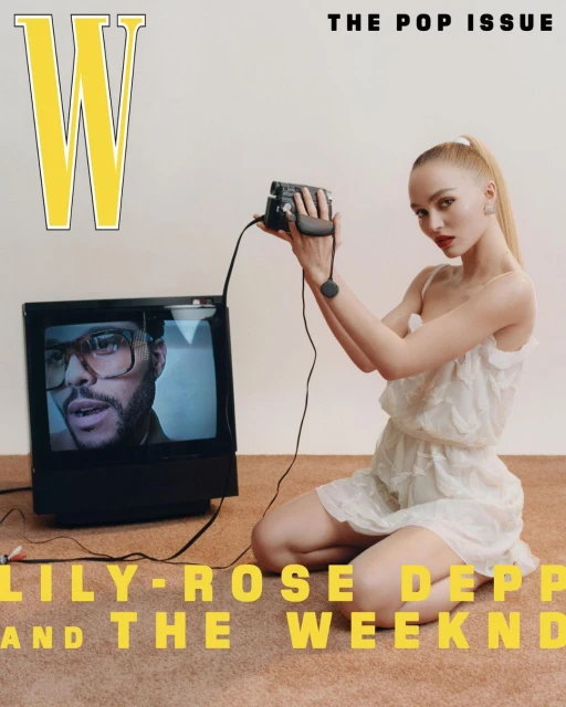 W Magazine cover featuring model with vintage video camera, actress Lily-Rose Depp on television screen, text: The Pop Issue, The Weeknd.
