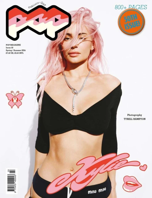 Pop Magazine cover featuring Kylie Jenner with pink hair, wearing a black top and briefs against a white background. Magazine issue.