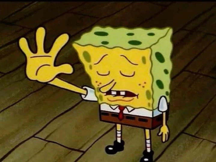 Spongebob Squarepants character with arm raised, wearing a tie, black shoes and in an indoor setting with brown wood-like floor.