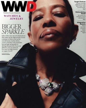Close-up portrait of a model wearing a dark leather jacket and a diamond floral necklace for WWD magazine by photographer Vanessa Granda.