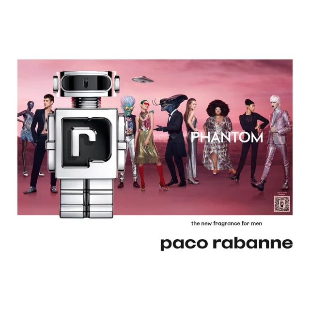 Robot-shaped Paco Rabanne Phantom perfume bottle among group of people against a pink background with a flying saucer image.
