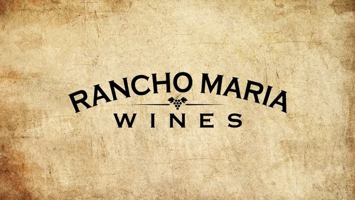 Black wine brand logo reading Rancho Maria Wines with a small grape bunch graphic on a textured parchment background