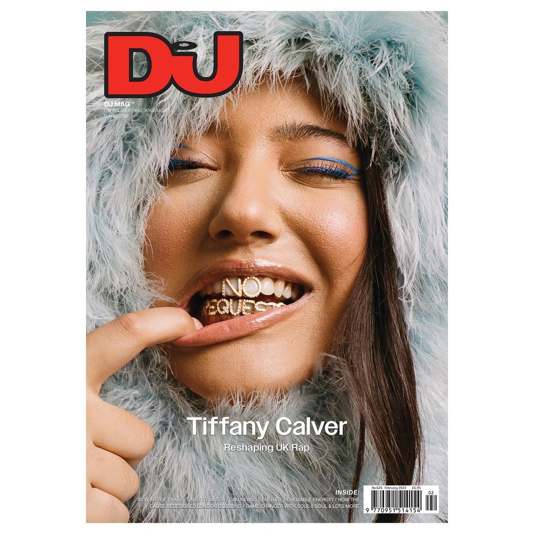 Magazine cover featuring Tiffany Calver with feathered boa, blue eyeliner, gold grill, and 'No Requests' text on teeth.
