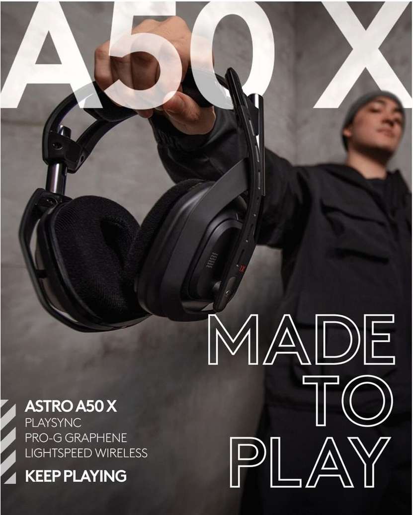 Astro A50 X gaming headset close-up held by a hand with a person in the background; grey textured background, gaming product advertisement.