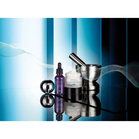 Product shot featuring skincare products in a mirrored setting with a mortar and pestle, set against a blue and black background.