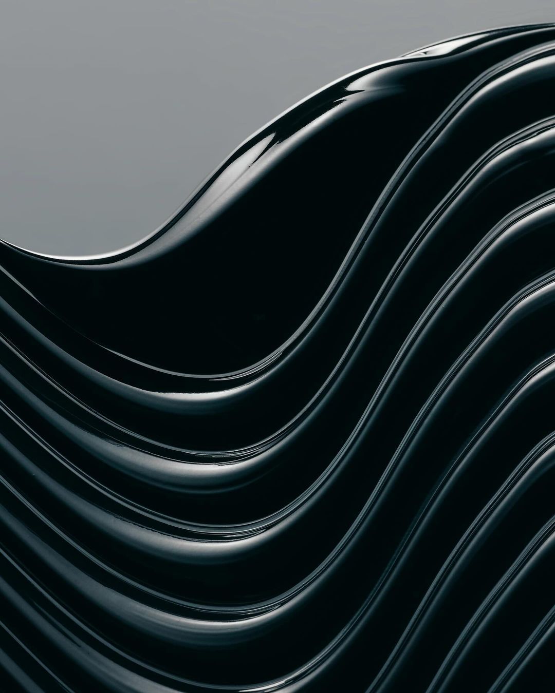 Dark blue abstract background with glossy, wavy lines creating a sense of flow and modern design, perfect for digital media.
