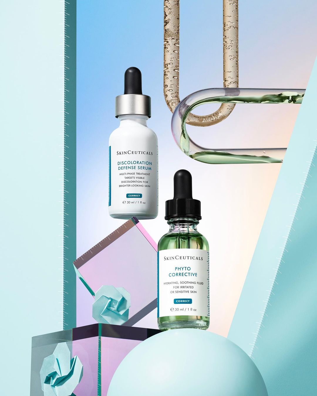 Still life product shot featuring SkinCeuticals serums arranged on geometric shapes in a photo studio with soft lighting and pastel colors.
