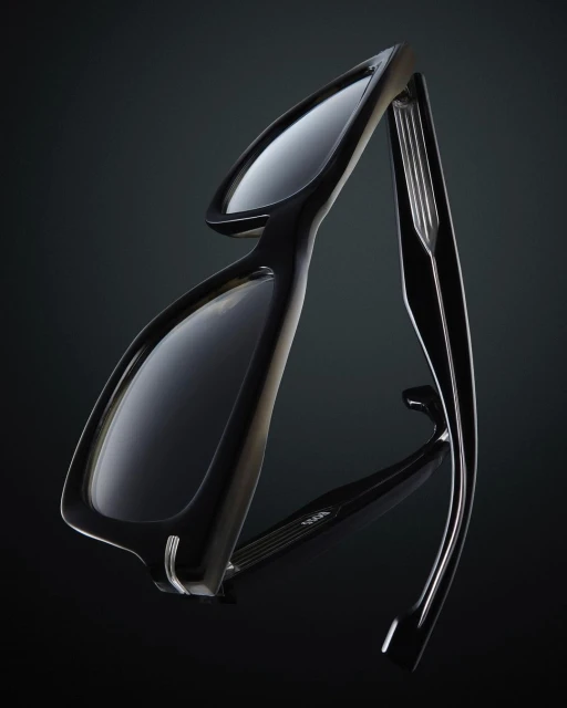 Close-up studio shot of sleek black eyeglasses with a reflective surface against a dark background, emphasizing the design and materials.