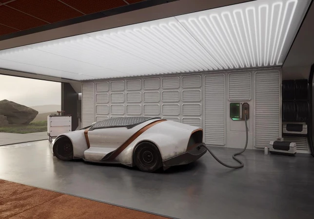 Futuristic white electric vehicle is plugged into a charger inside of a modern garage with white walls and a gray concrete floor.