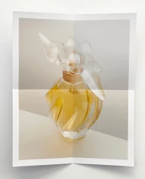 Close-up of a luxury perfume bottle with golden liquid and a sculptural white cap photographed by Vincent Gapaillard