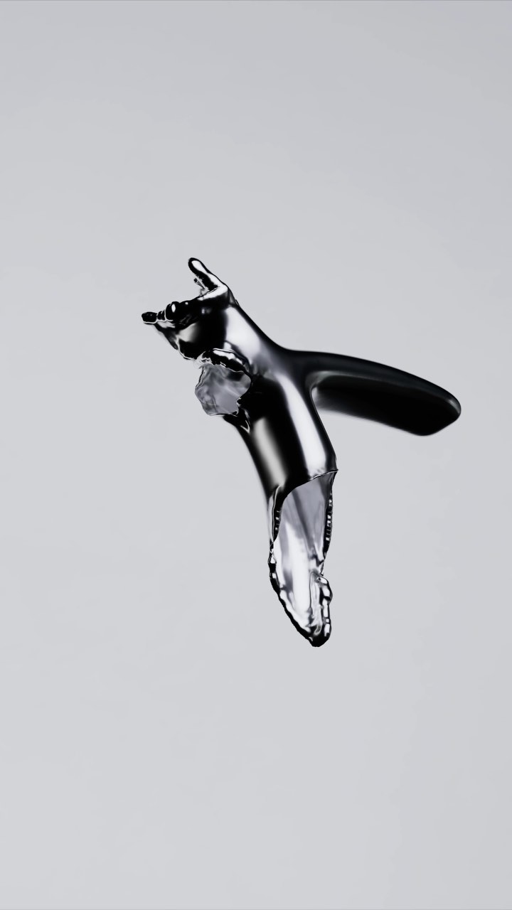 Chrome faucet in a studio shot with water dripping out of the tap against a gray background, illustrating plumbing concept.
