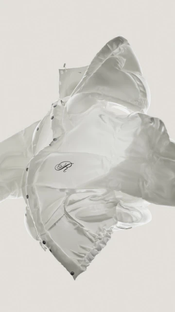 Floating, translucent white puffer jacket against an off-white background in a vertical studio shot. Fashion and clothing concept.