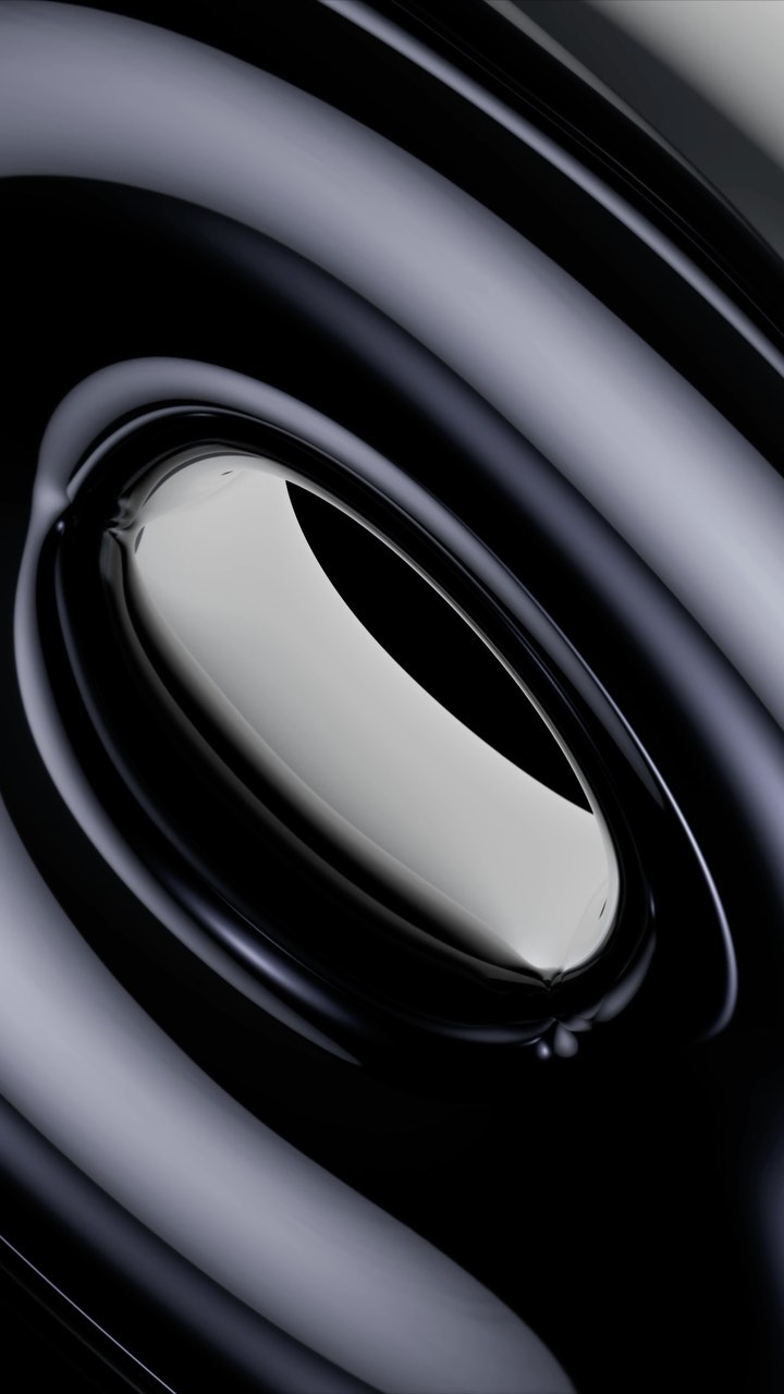 Abstract, close-up view of fluid with concentric light and dark shades creates a visually striking and glossy background or texture.