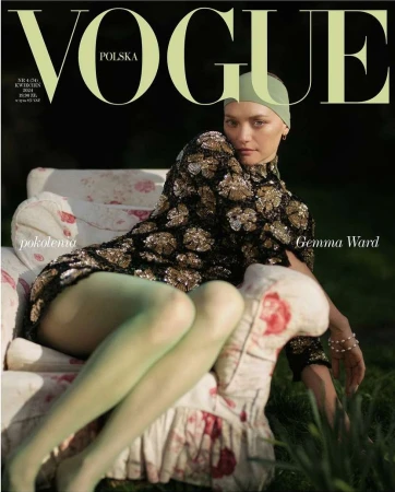 Vogue Polska cover featuring Gemma Ward in a black and gold dress, seated on a floral couch in a garden setting, with a vintage aesthetic.