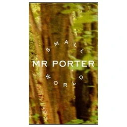Close-up of blurred forest background with overlaid white text that reads Small World MR PORTER in the centre.