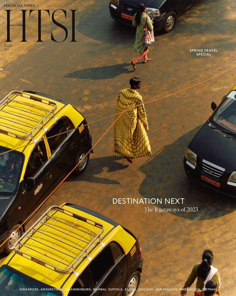 Cover of Financial Times HTSI magazine featuring pedestrians and taxis in an urban setting, with a focus on travel destinations.