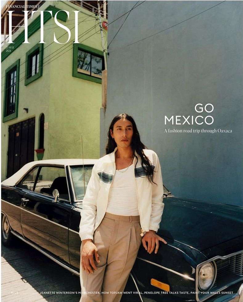 Magazine cover featuring a man leaning on a vintage car against a vibrant architectural backdrop in Mexico; 'GO MEXICO' is prominently displayed.
