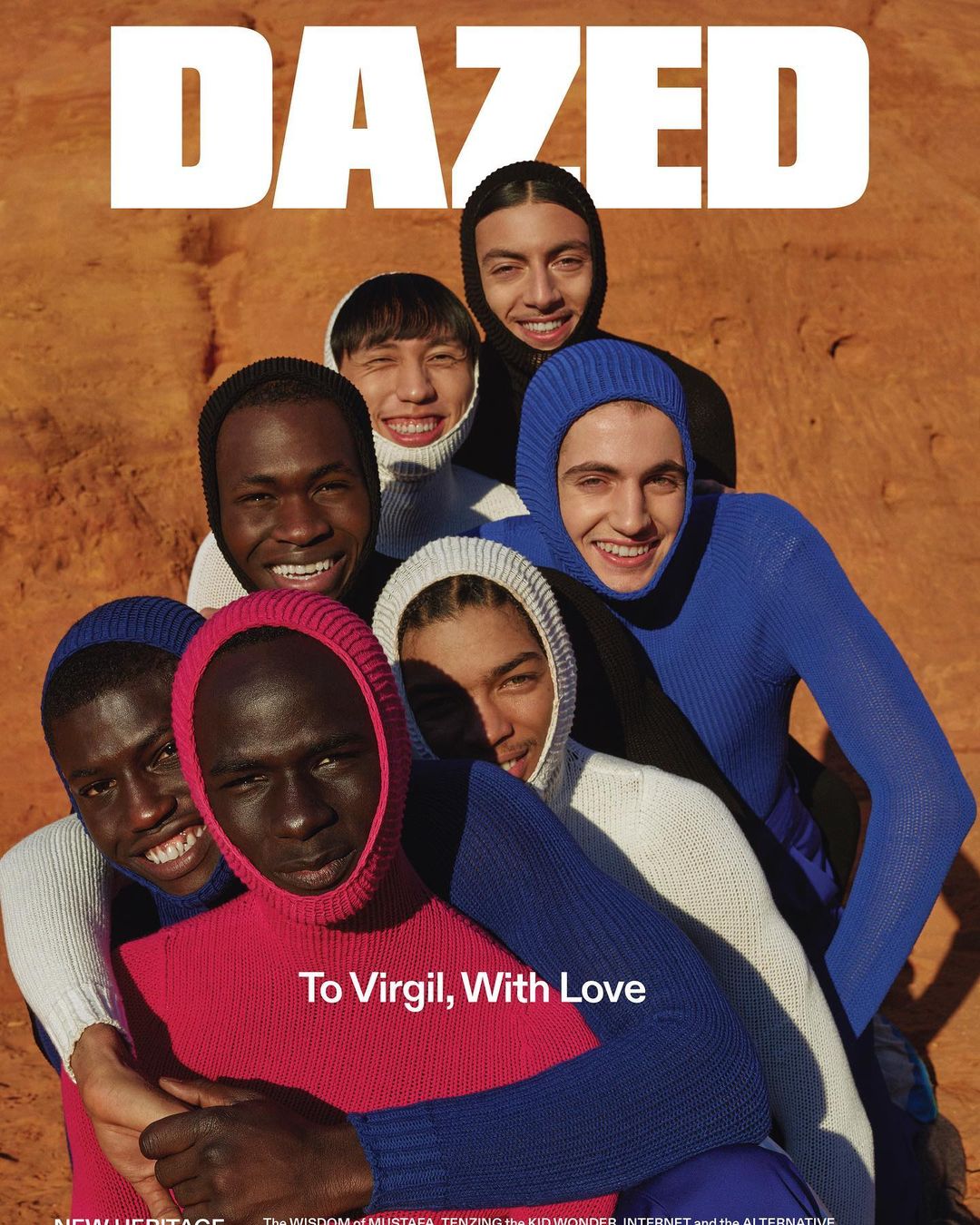 Magazine cover featuring a group of smiling young adult models of mixed ethnicities wearing colourful knit hoods and hugging in an outdoor setting.