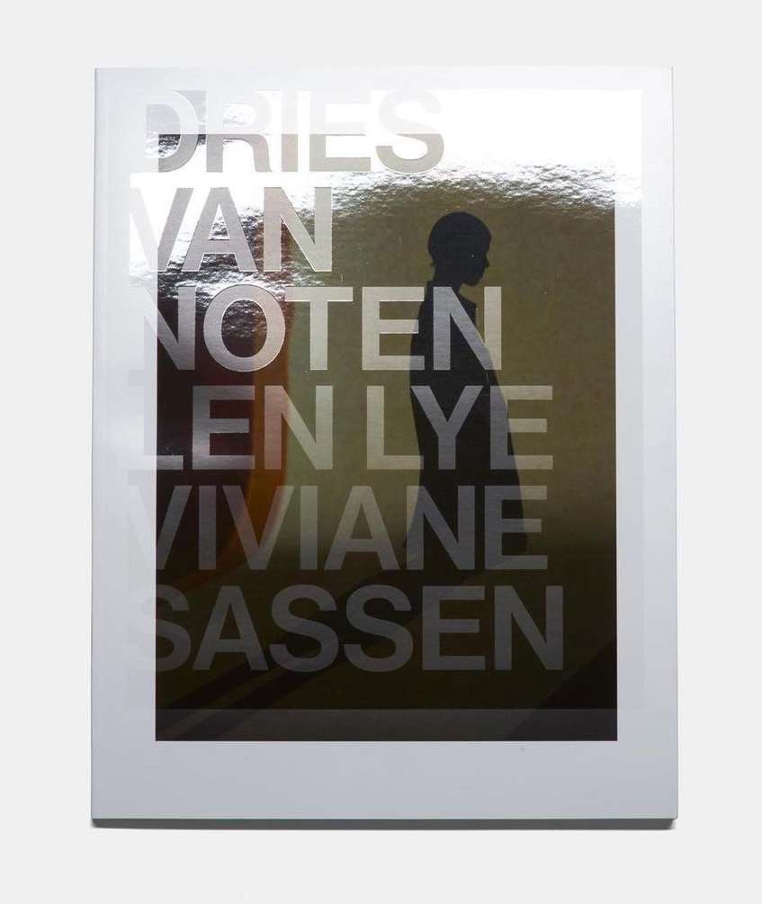 Fashion book cover featuring a silhouette and overlaid text of 'Dries Van Noten, Len Lye, and Viviane Sassen' on a reflective background.